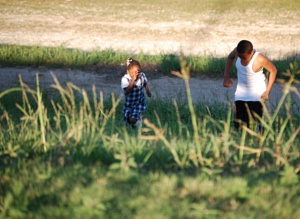 Children playing on levee near Overlook